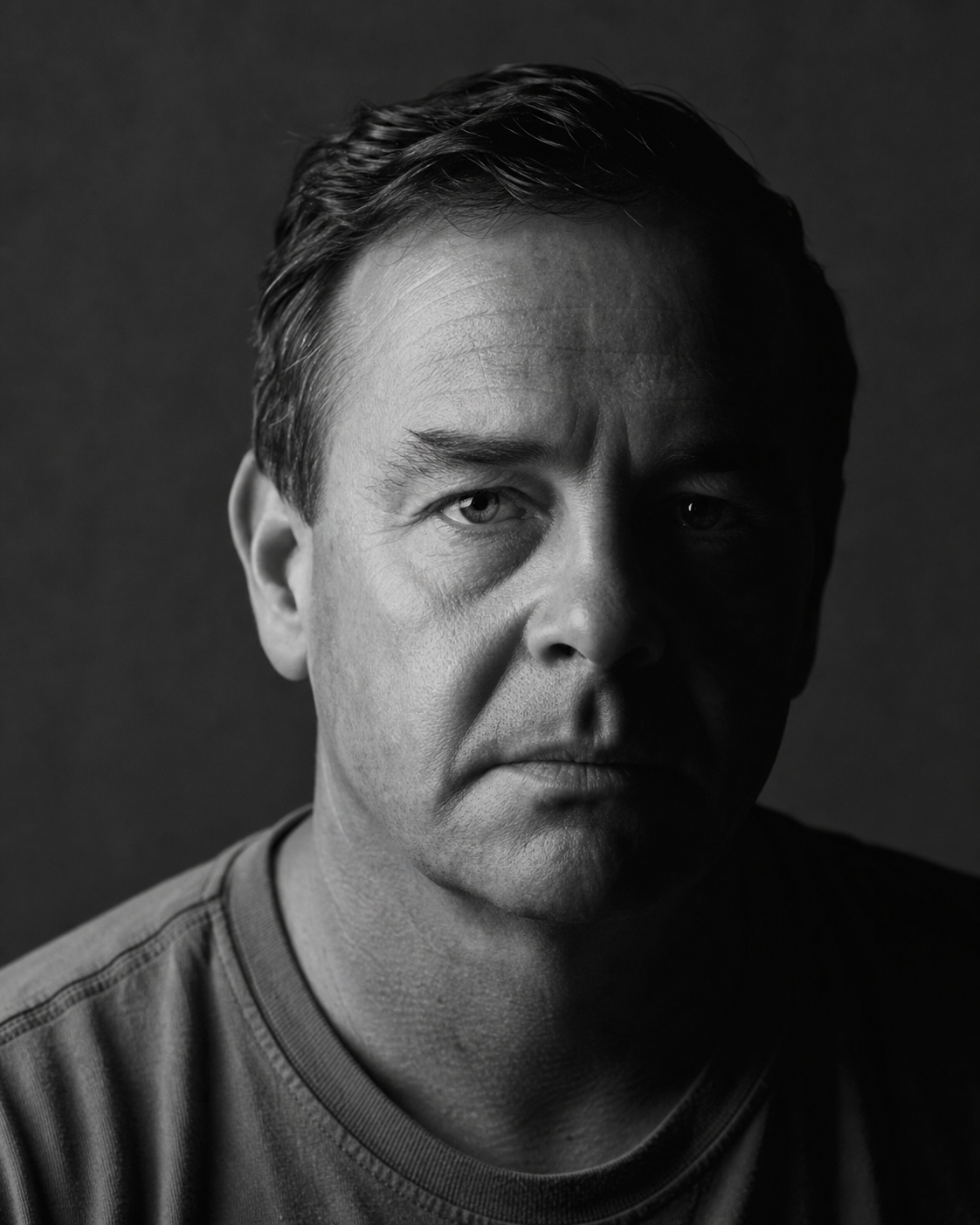 Black-and-white portrait in hard side light