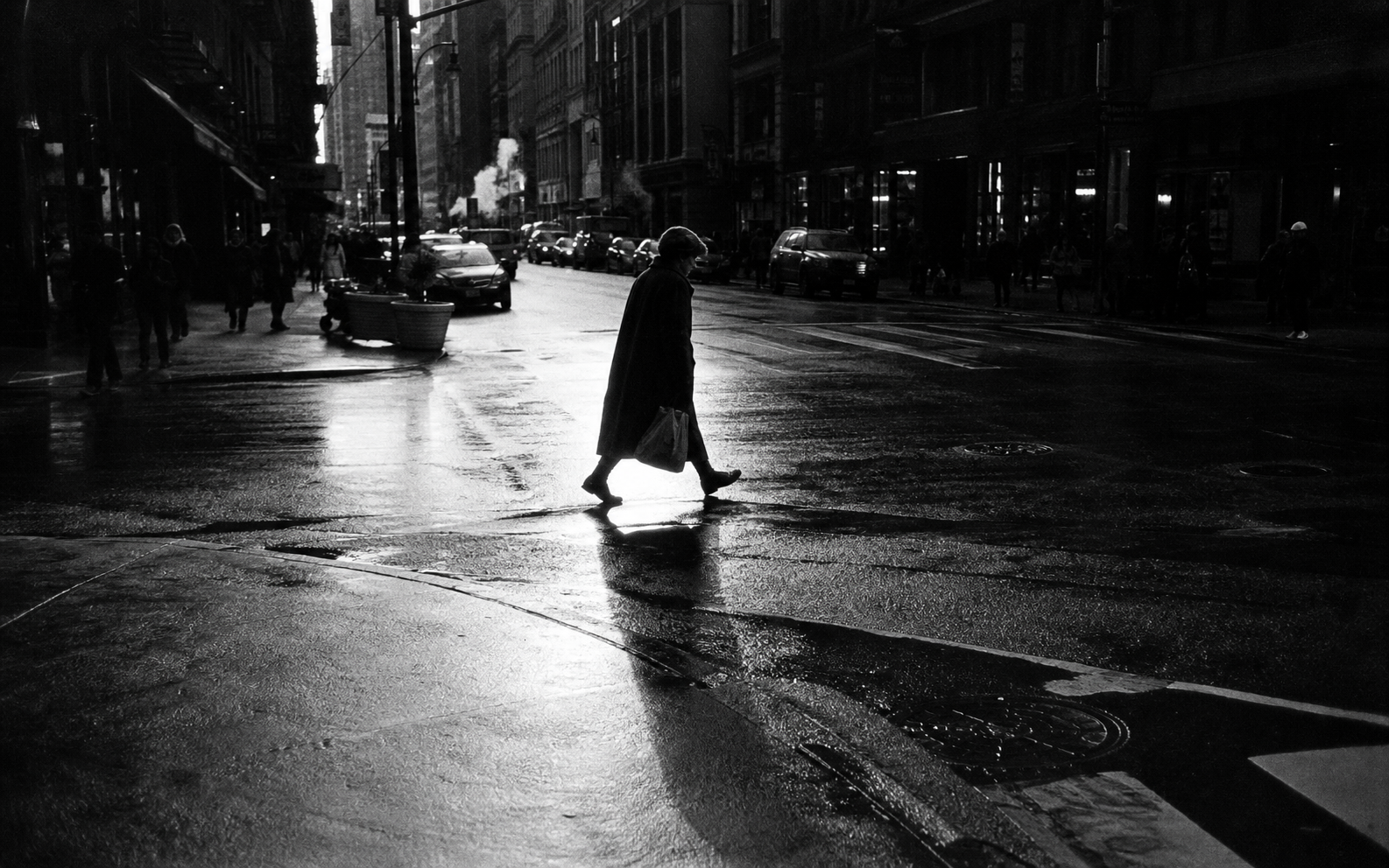 Black-and-white street scene, backlit crossing